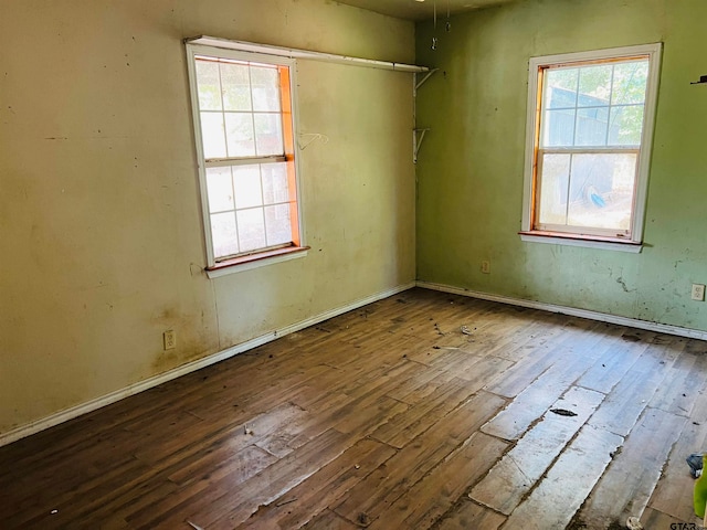 empty room featuring wood-type flooring