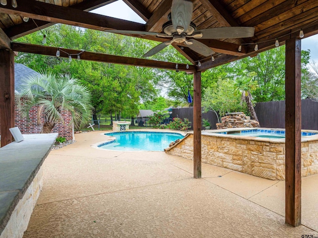 view of swimming pool featuring a ceiling fan, a fenced backyard, a fenced in pool, and a patio