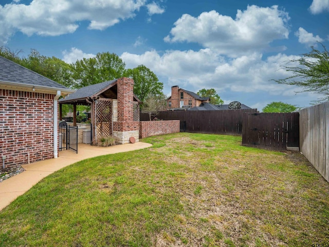 view of yard featuring a fenced backyard and a patio area