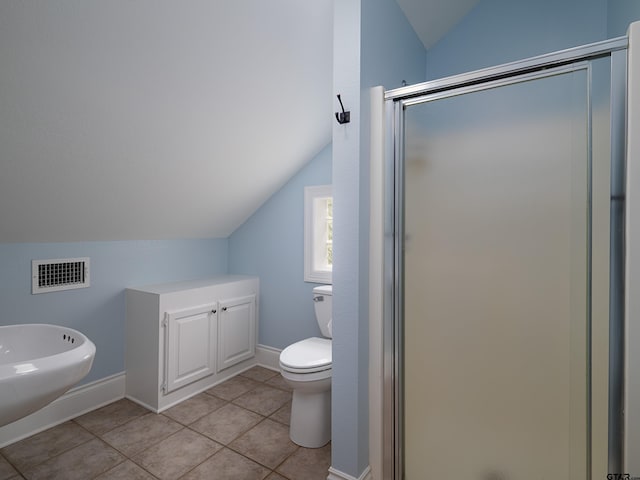 bathroom featuring visible vents, toilet, tile patterned floors, a stall shower, and vaulted ceiling