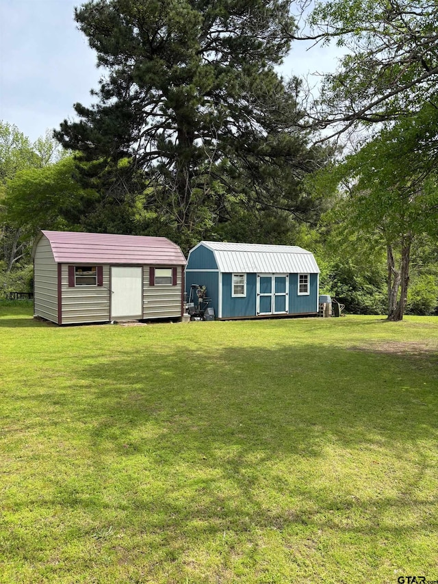 exterior space featuring a front lawn and a shed