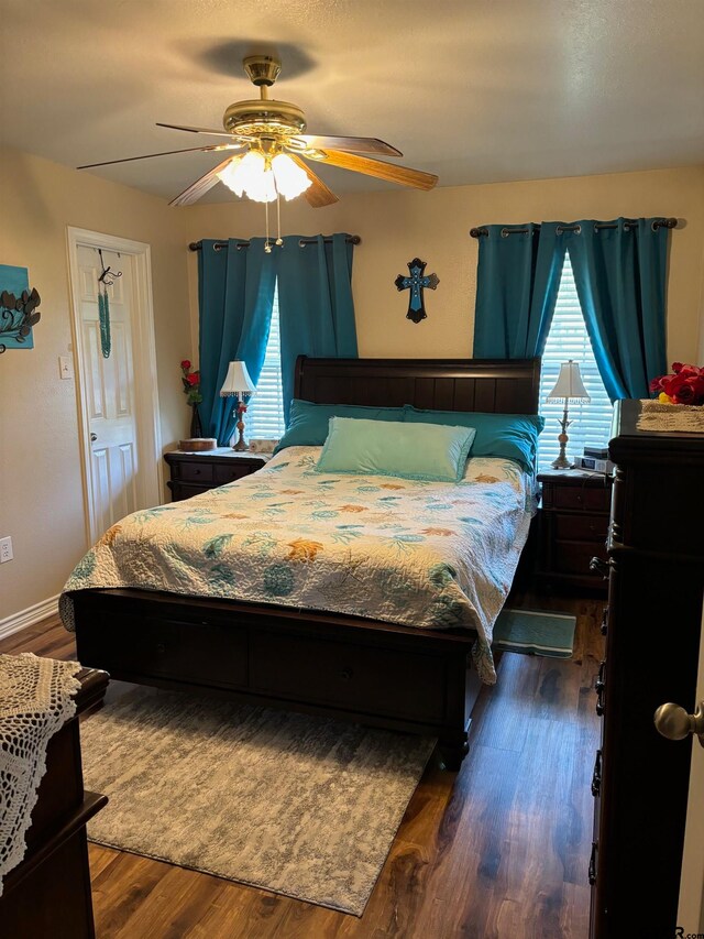 bedroom featuring ceiling fan and dark hardwood / wood-style flooring