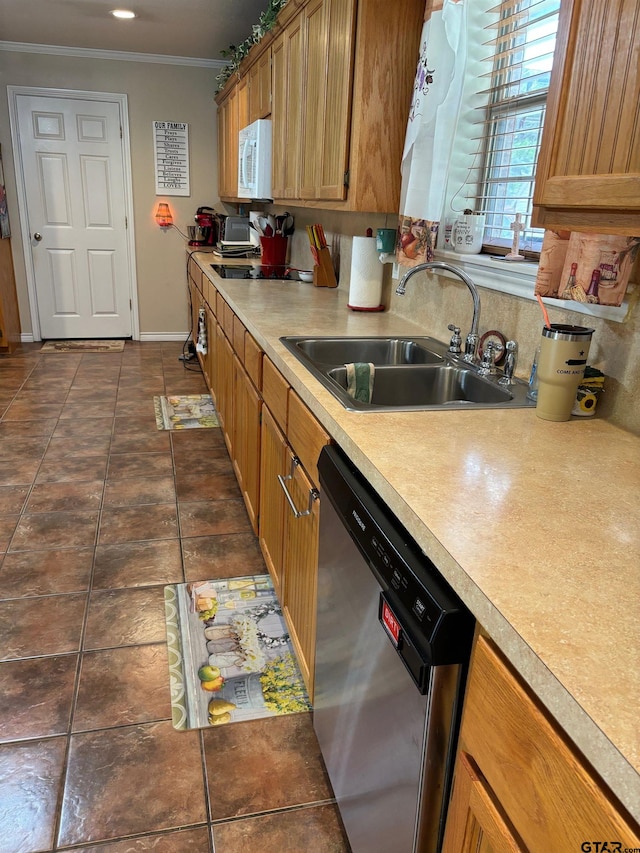 kitchen featuring dishwasher, dark tile patterned flooring, ornamental molding, and sink