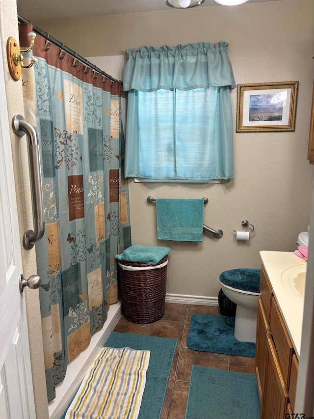 bathroom with vanity, a shower with shower curtain, tile patterned floors, and toilet