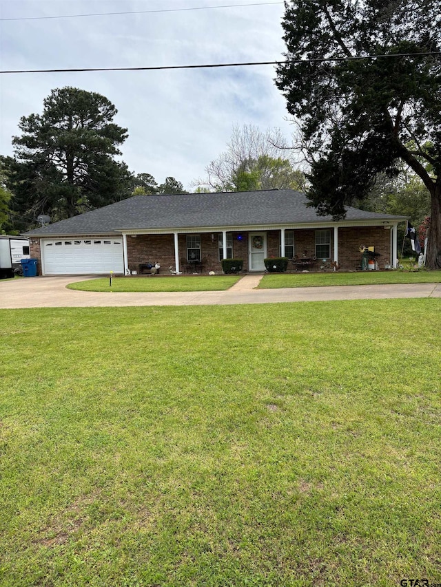 single story home featuring a garage and a front lawn