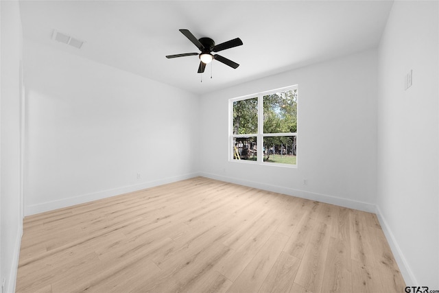 empty room featuring light wood-type flooring and ceiling fan