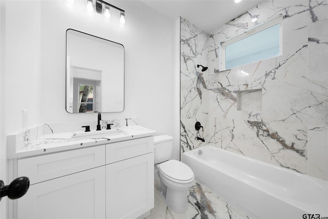 full bathroom featuring toilet, vanity, and tiled shower / bath