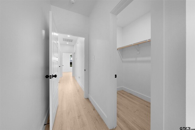 hall with light hardwood / wood-style flooring