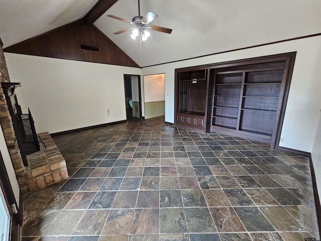 236 La Jolla Dr, Athens, TX 75751 - unfurnished living room featuring a ceiling fan, baseboards, and dark stone finish floors
