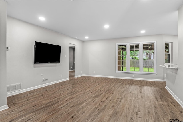 1004 Bunny Rabbit Rd, Athens, TX 75751 - unfurnished living room with wood finished floors and recessed lighting