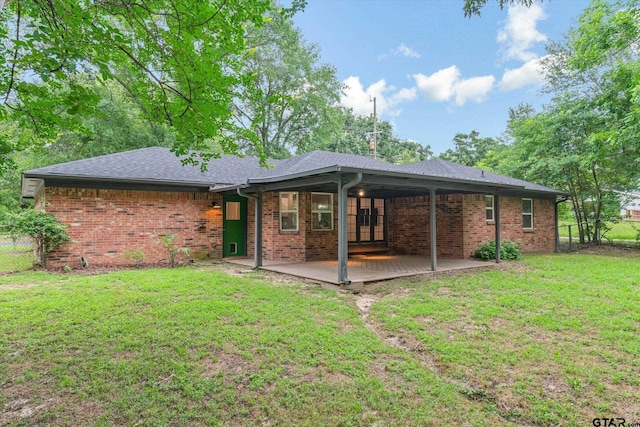 1004 Bunny Rabbit Rd, Athens, TX 75751 - rear view of property featuring brick siding and roof with shingles