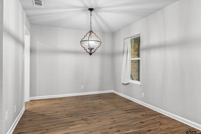 1004 Bunny Rabbit Rd, Athens, TX 75751 - empty room featuring dark wood-type flooring and a chandelier
