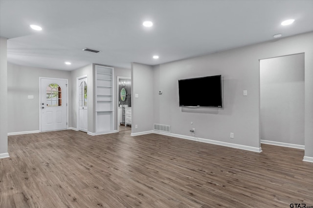 1004 Bunny Rabbit Rd, Athens, TX 75751 - unfurnished living room with wood finished floors and recessed lighting