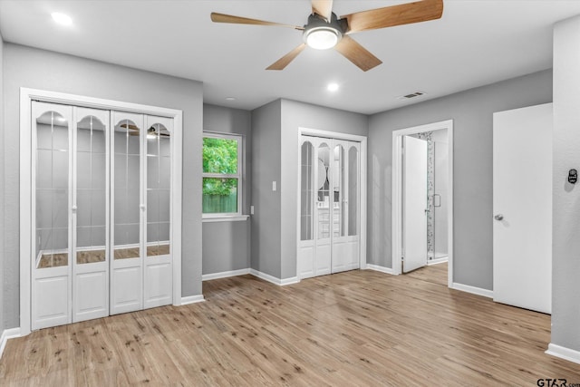 1004 Bunny Rabbit Rd, Athens, TX 75751 - unfurnished bedroom with multiple closets, wood finished floors, recessed lighting, and a ceiling fan