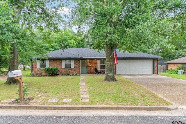 1004 Bunny Rabbit Rd, Athens, TX 75751 - view of front of home featuring concrete driveway, an attached garage, a front lawn, brick siding, and a shingled roof