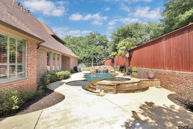 6805 Castle Pines Ct, Tyler, TX 75703 - view of patio with a fenced backyard and a pool with connected hot tub