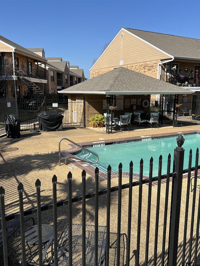 view of swimming pool featuring a patio area