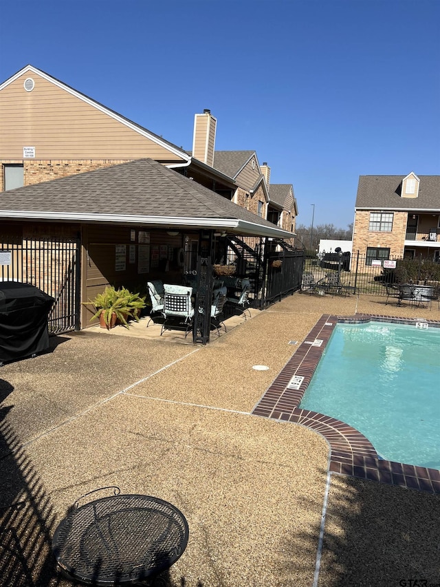 view of swimming pool featuring a patio