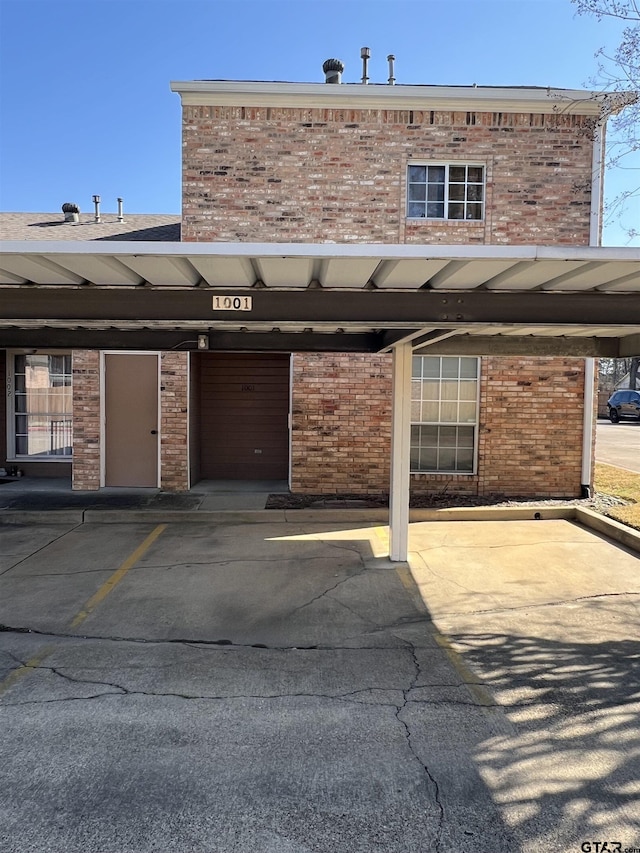 view of parking / parking lot with a carport