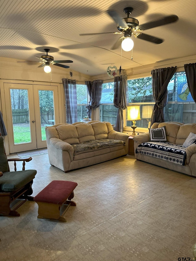 living room featuring a healthy amount of sunlight, ceiling fan, and french doors