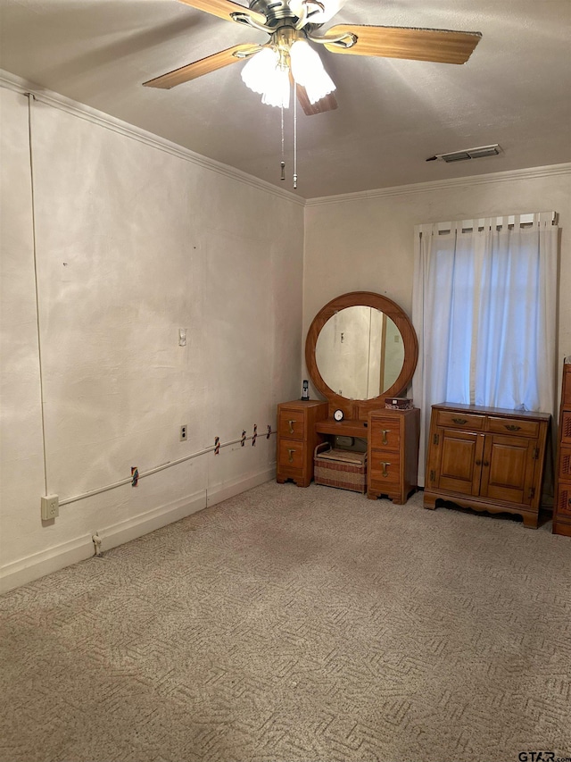 unfurnished bedroom with carpet flooring, ceiling fan, and crown molding