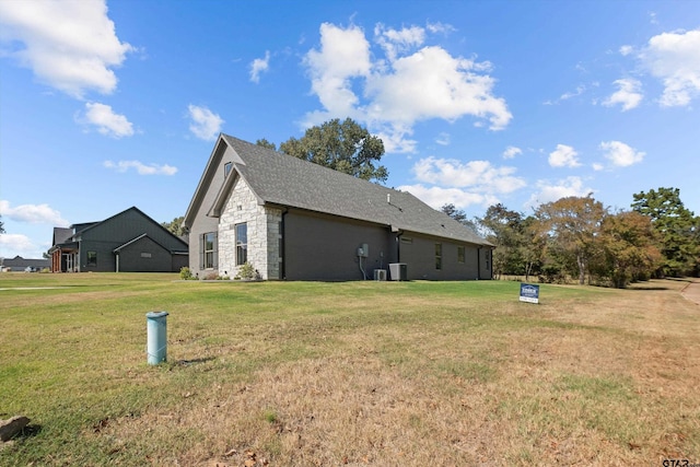 view of side of home featuring a yard