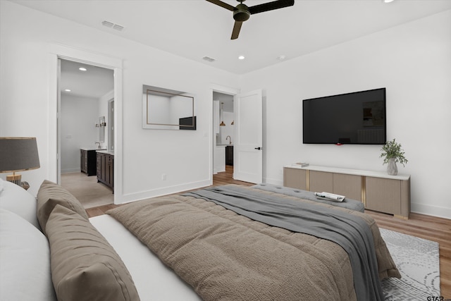 bedroom featuring light hardwood / wood-style flooring and ceiling fan