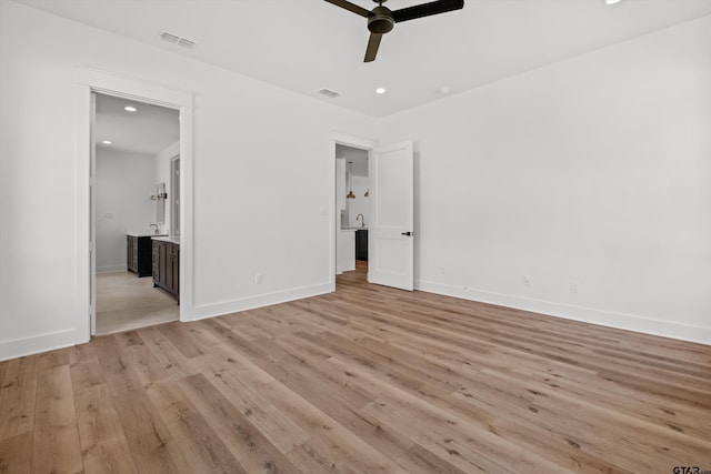 unfurnished bedroom with ceiling fan and light hardwood / wood-style floors