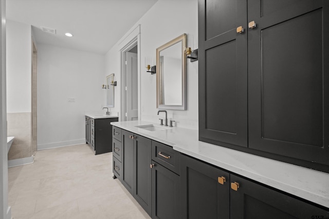 bathroom featuring tile patterned floors and vanity