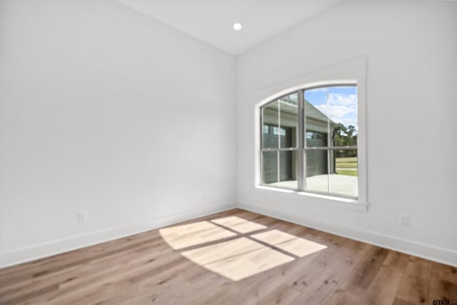 empty room with light hardwood / wood-style floors