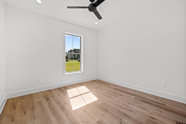 unfurnished room featuring ceiling fan and light hardwood / wood-style flooring