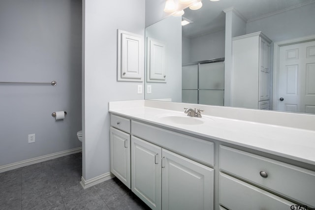 11831 Smallwood Dr, Flint, TX 75762 - bathroom featuring toilet, vanity, baseboards, and a shower with shower door
