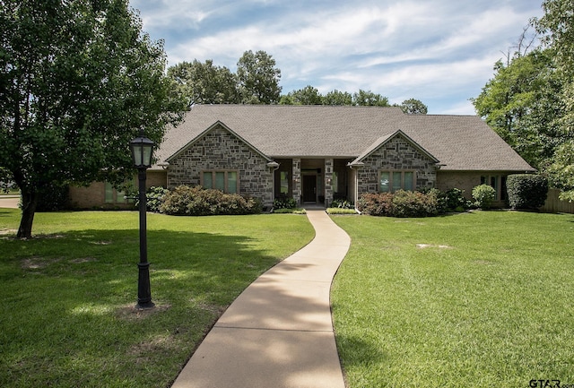 11831 Smallwood Dr, Flint, TX 75762 - view of front of property featuring stone siding, a front lawn, and roof with shingles