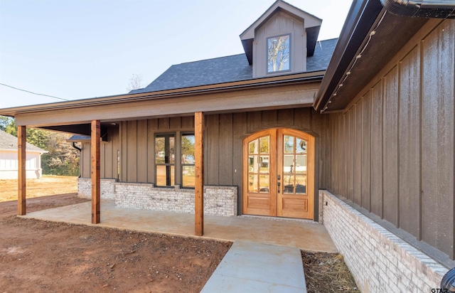 entrance to property featuring french doors