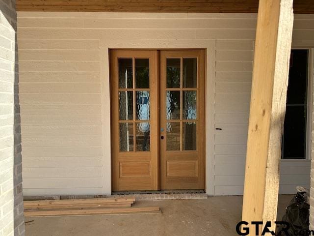 entrance to property featuring french doors