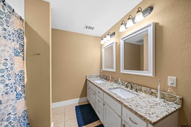 bathroom featuring tile patterned floors and vanity