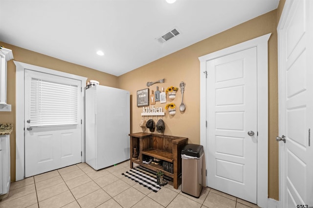 entrance foyer with light tile patterned floors