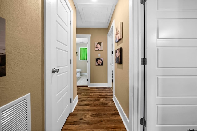 hallway with dark hardwood / wood-style floors