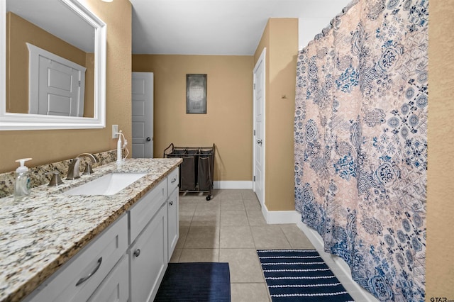 bathroom with tile patterned flooring and vanity