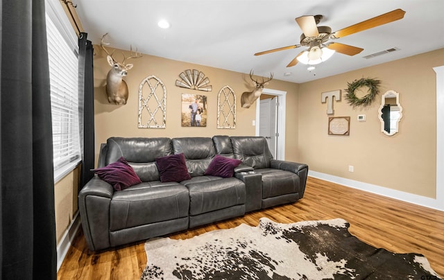 living room with ceiling fan and hardwood / wood-style floors