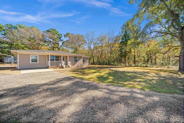 view of yard with covered porch