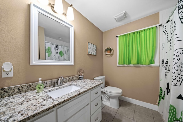 bathroom featuring tile patterned flooring, vanity, curtained shower, and toilet