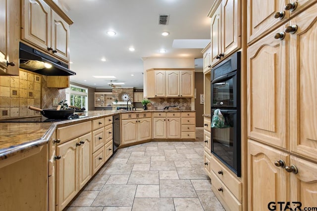 kitchen featuring black appliances, decorative backsplash, light brown cabinets, and kitchen peninsula