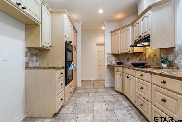 kitchen with light stone countertops, light brown cabinetry, backsplash, crown molding, and black appliances