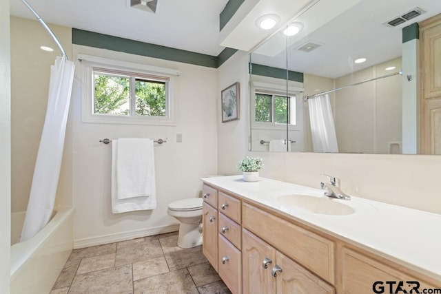 full bathroom featuring shower / tub combo with curtain, vanity, and toilet