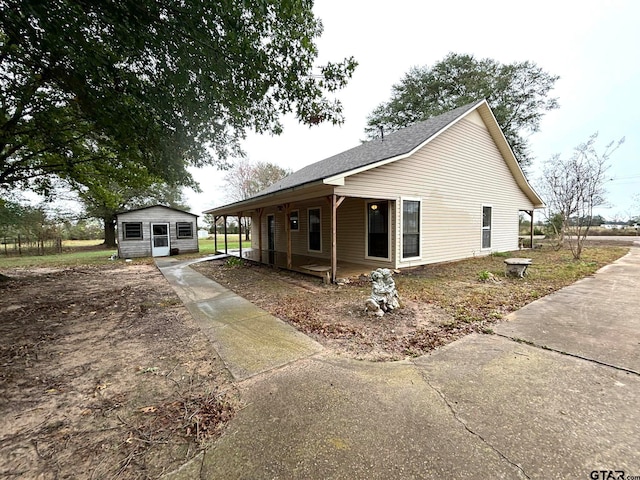 view of side of property with a porch