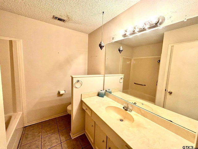 full bathroom featuring tile patterned flooring, shower / bath combination, a textured ceiling, toilet, and vanity