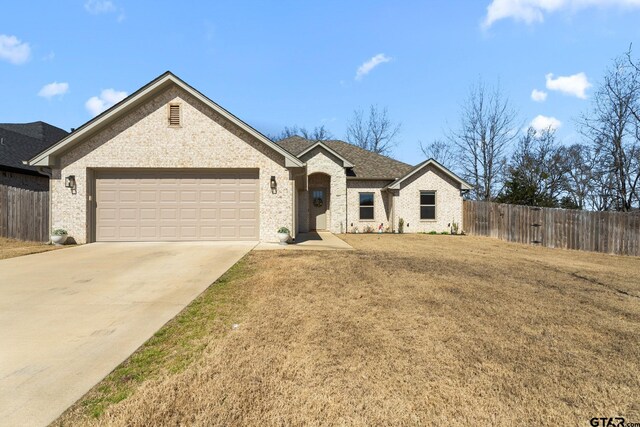 10071 Dayspring, Flint, TX 75762 - ranch-style house with an attached garage, driveway, and brick siding