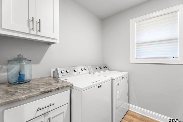 10071 Dayspring, Flint, TX 75762 - laundry area with washing machine and dryer, cabinet space, and light wood-style flooring