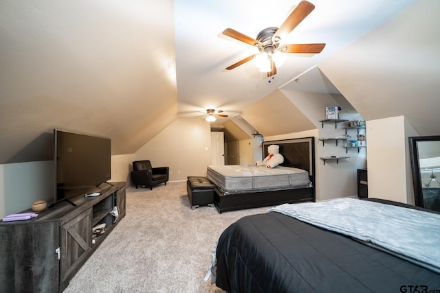 bedroom with light colored carpet, lofted ceiling, and ceiling fan